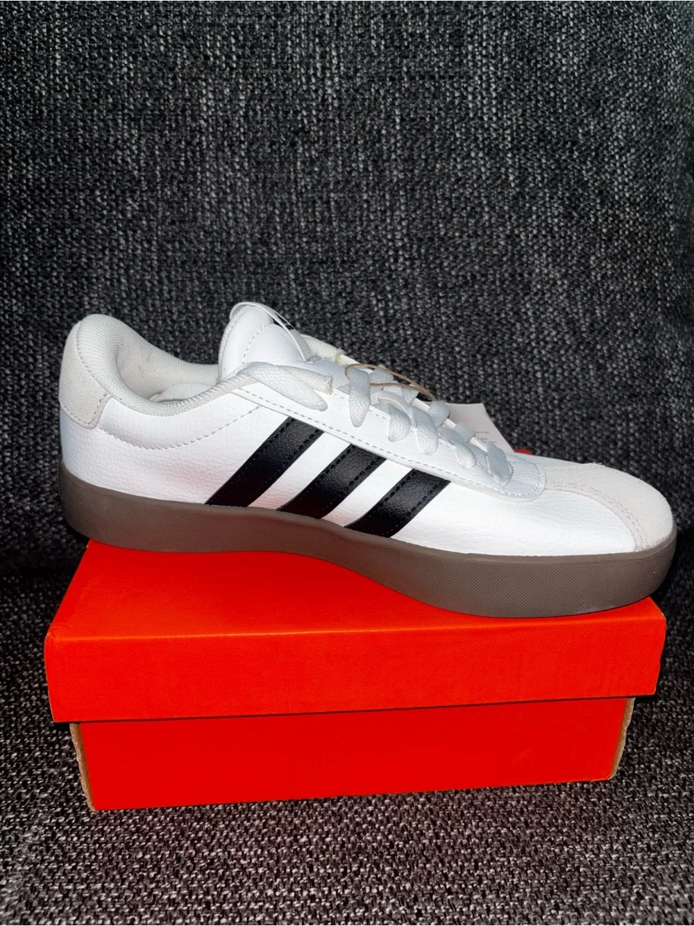 Adidas unisex White Sneaker with Black Stripes
